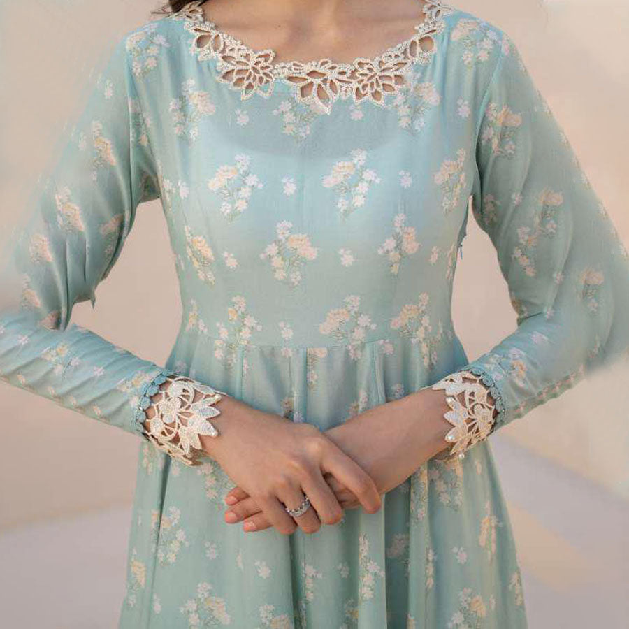IZNIK Festive Lawn 25 EFL – Luxury Pakistani embroidered lawn suit in pastel shades with delicate floral detailing, intricate embroidery and chiffon dupatta, perfect for festive wear.