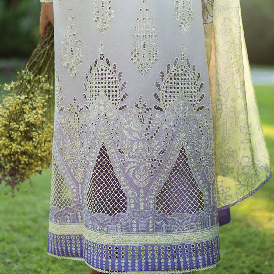 A model wearing a pastel embroidered lawn suit, featuring delicate floral patterns and a matching dupatta, ideal for summer occasions, sitting in a garden setting, showcasing traditional elegance and comfort, wearing a chickenkari embroidered dress.