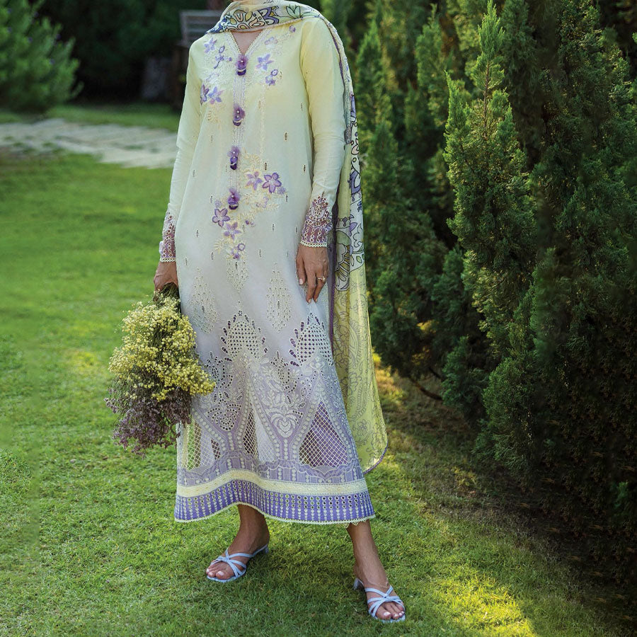 A model wearing a pastel embroidered lawn suit, featuring delicate floral patterns and a matching dupatta, ideal for summer occasions, sitting in a garden setting, showcasing traditional elegance and comfort, wearing a chickenkari embroidered dress.
