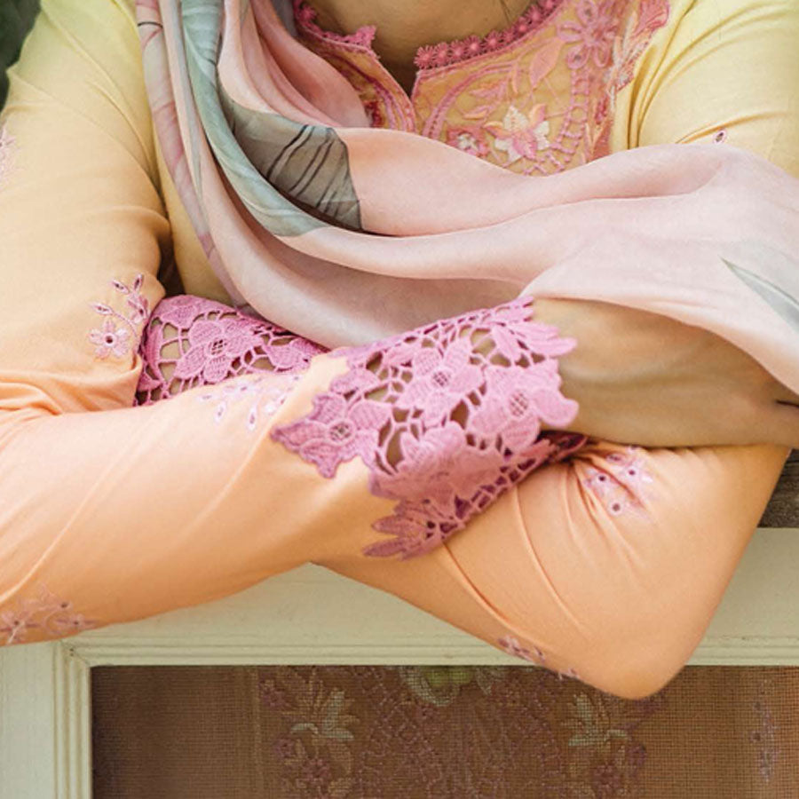 A model wearing a pastel embroidered lawn suit, featuring delicate floral patterns and a matching dupatta, ideal for summer occasions, sitting in a garden setting, showcasing traditional elegance and comfort, wearing a chickenkari embroidered dress.