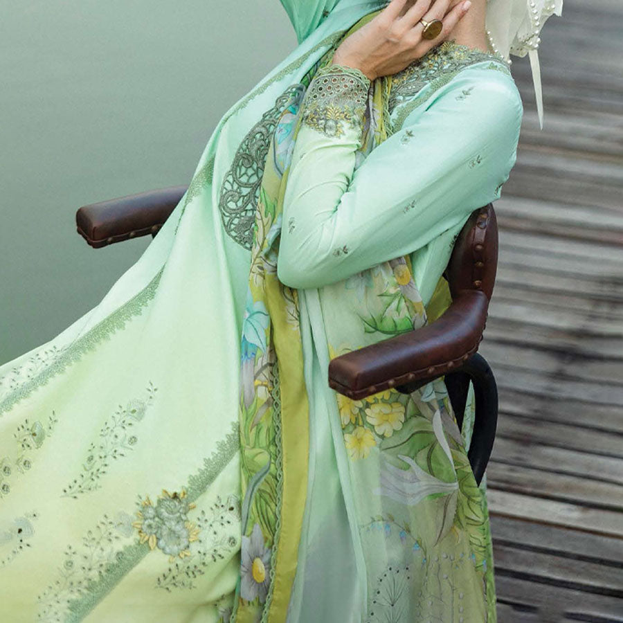 A model wearing a pastel embroidered lawn suit, featuring delicate floral patterns and a matching dupatta, ideal for summer occasions, sitting in a garden setting, showcasing traditional elegance and comfort, wearing a chickenkari embroidered dress.