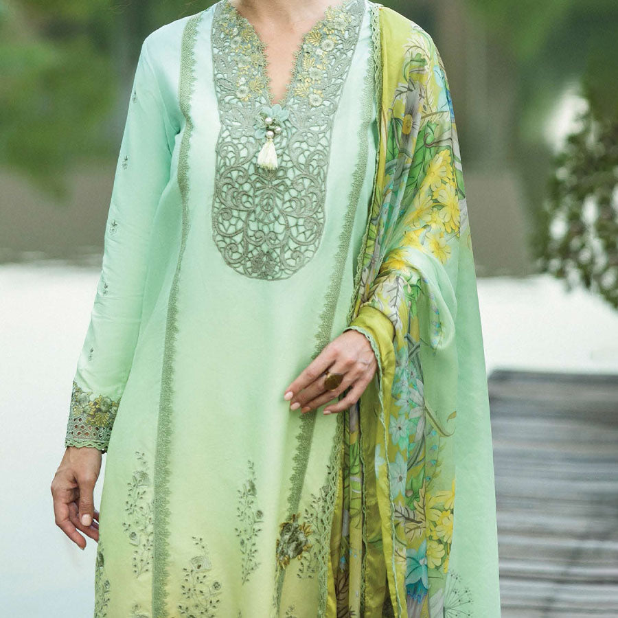 A model wearing a pastel embroidered lawn suit, featuring delicate floral patterns and a matching dupatta, ideal for summer occasions, sitting in a garden setting, showcasing traditional elegance and comfort, wearing a chickenkari embroidered dress.