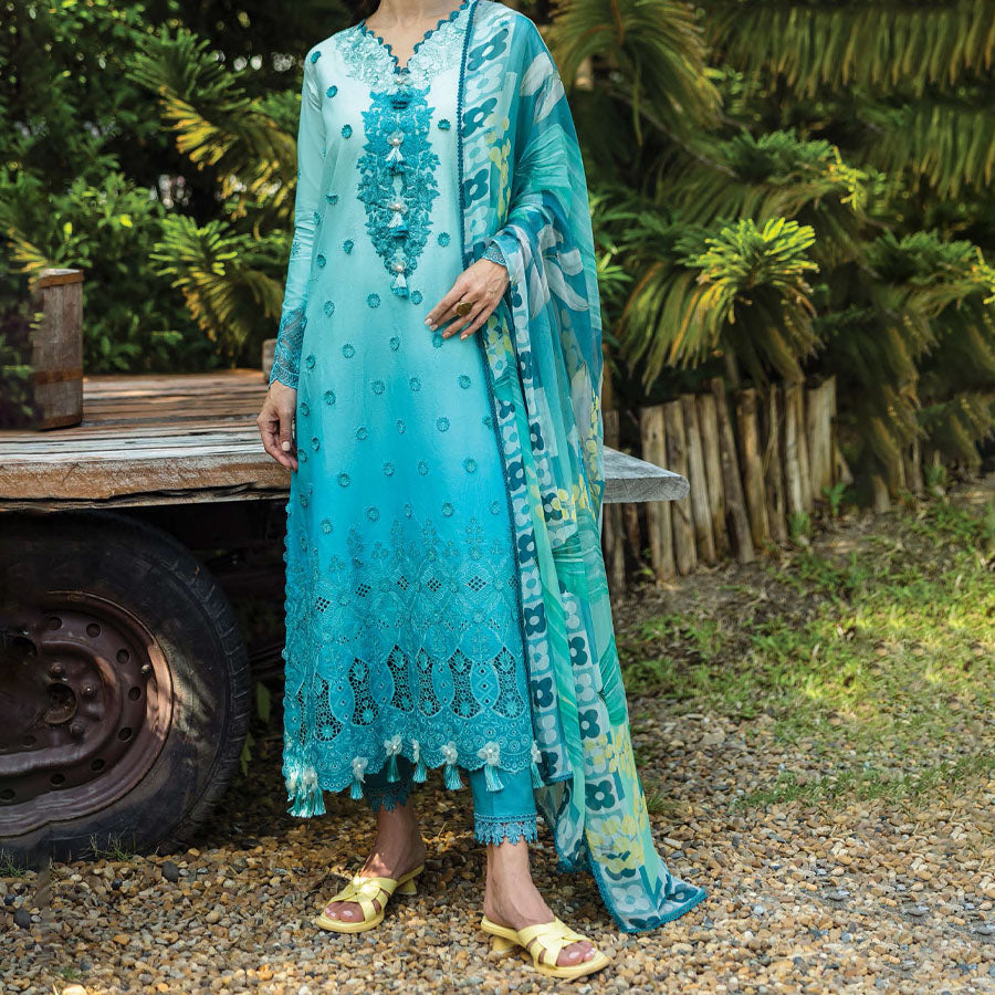 A model wearing a pastel embroidered lawn suit, featuring delicate floral patterns and a matching dupatta, ideal for summer occasions, sitting in a garden setting, showcasing traditional elegance and comfort, wearing a chickenkari embroidered dress.