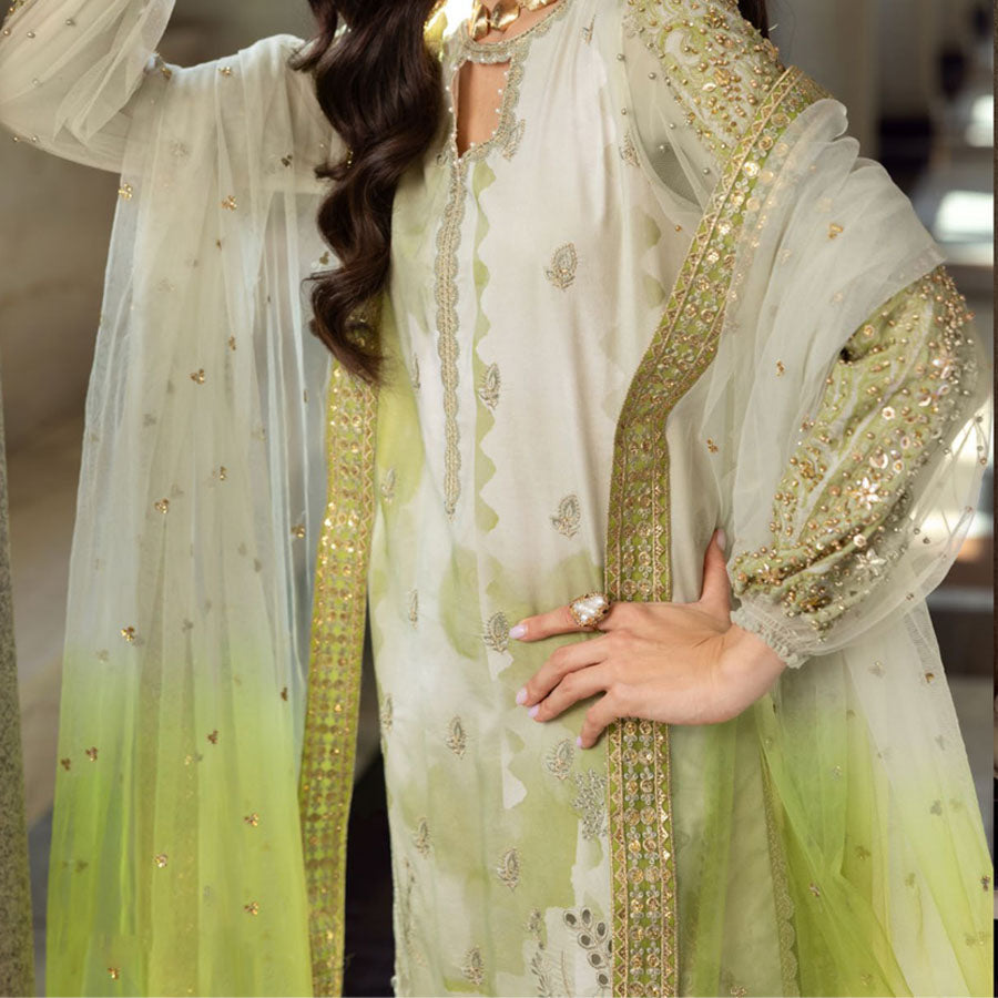 Charizma Festive Unstitched Collection 2025 – Two models wearing elegant embroidered Pakistani suits in pastel blue and golden yellow, featuring intricate handwork, sequins, and delicate embellishments, perfect for Eid celebrations and festive occasions.