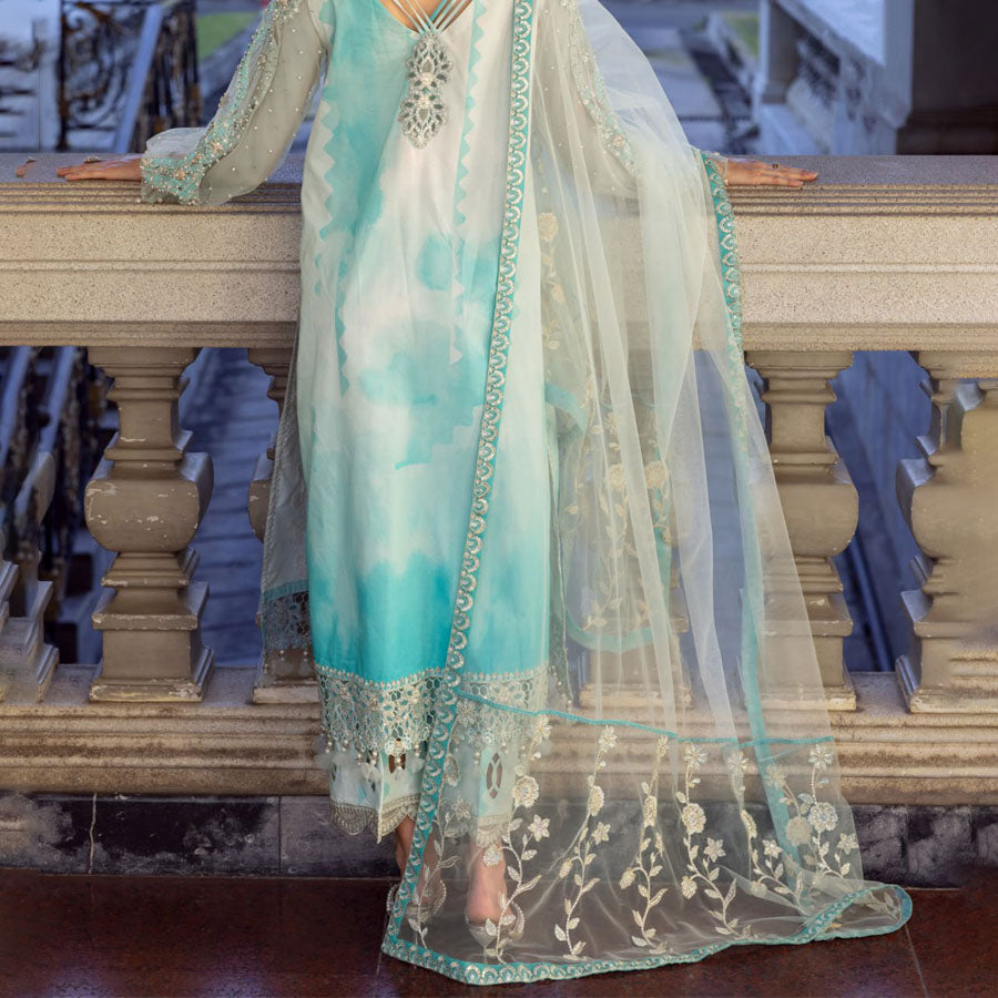 Charizma Festive Unstitched Collection 2025 – Two models wearing elegant embroidered Pakistani suits in pastel blue and golden yellow, featuring intricate handwork, sequins, and delicate embellishments, perfect for Eid celebrations and festive occasions.