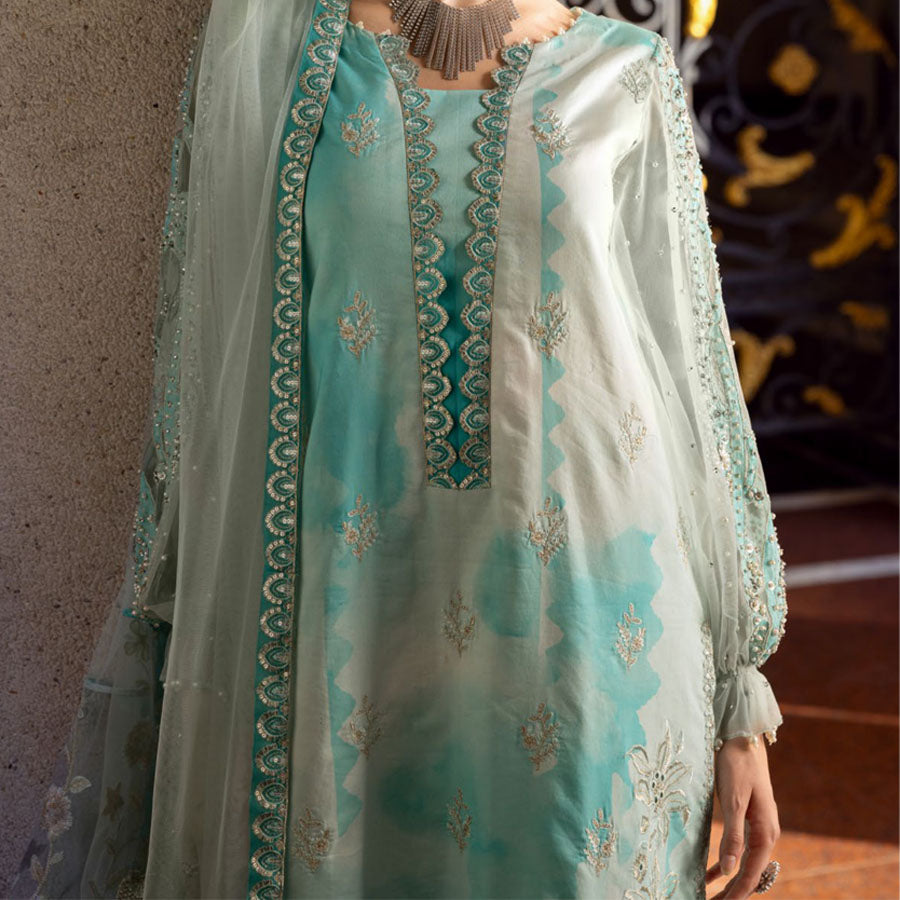 Charizma Festive Unstitched Collection 2025 – Two models wearing elegant embroidered Pakistani suits in pastel blue and golden yellow, featuring intricate handwork, sequins, and delicate embellishments, perfect for Eid celebrations and festive occasions.
