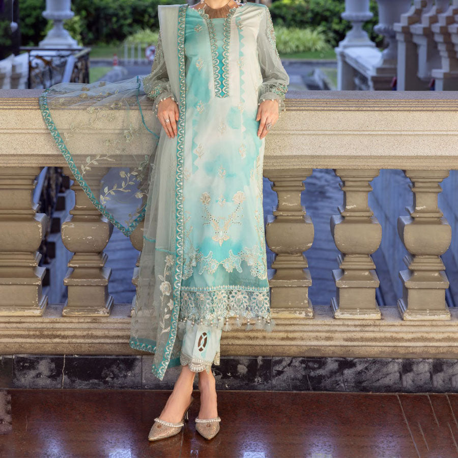 Charizma Festive Unstitched Collection 2025 – Two models wearing elegant embroidered Pakistani suits in pastel blue and golden yellow, featuring intricate handwork, sequins, and delicate embellishments, perfect for Eid celebrations and festive occasions.