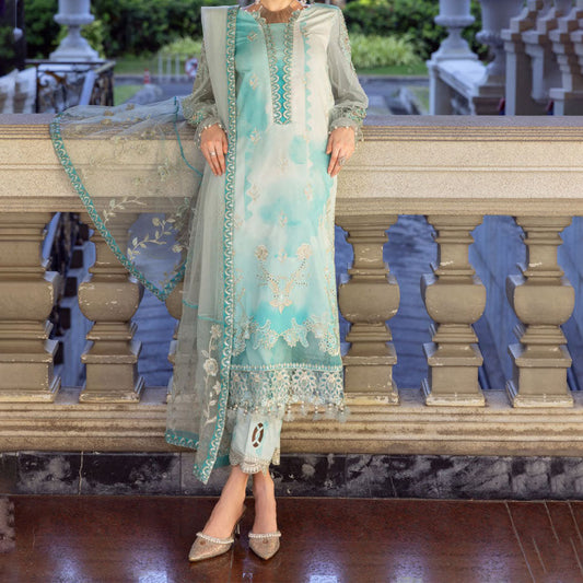Charizma Festive Unstitched Collection 2025 – Two models wearing elegant embroidered Pakistani suits in pastel blue and golden yellow, featuring intricate handwork, sequins, and delicate embellishments, perfect for Eid celebrations and festive occasions.