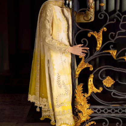 Charizma Festive Unstitched Collection 2025 – Two models wearing elegant embroidered Pakistani suits in pastel blue and golden yellow, featuring intricate handwork, sequins, and delicate embellishments, perfect for Eid celebrations and festive occasions.