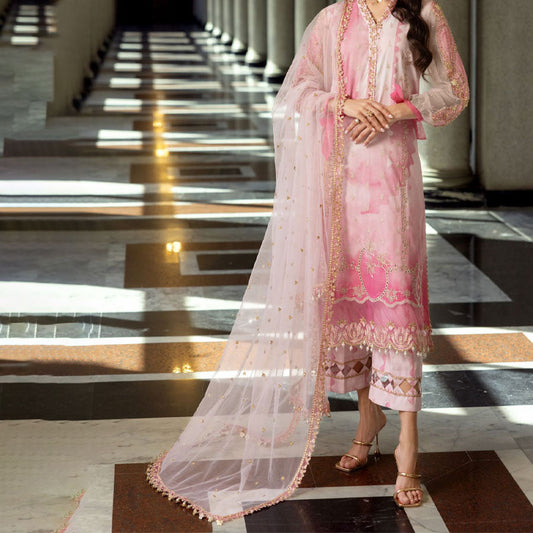 Charizma Festive Unstitched Collection 2025 – Two models wearing elegant embroidered Pakistani suits in pastel blue and golden yellow, featuring intricate handwork, sequins, and delicate embellishments, perfect for Eid celebrations and festive occasions.