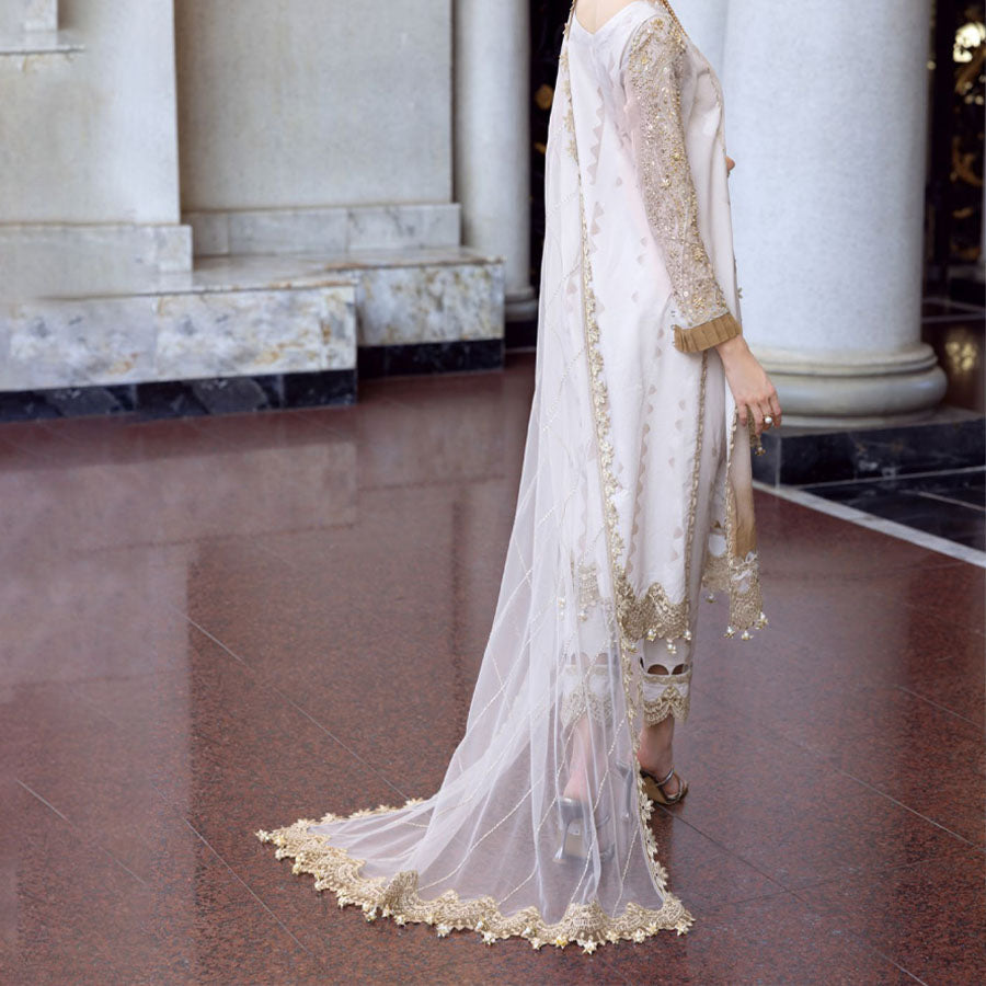 Charizma Festive Unstitched Collection 2025 – Two models wearing elegant embroidered Pakistani suits in pastel blue and golden yellow, featuring intricate handwork, sequins, and delicate embellishments, perfect for Eid celebrations and festive occasions.