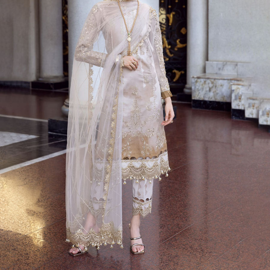 Charizma Festive Unstitched Collection 2025 – Two models wearing elegant embroidered Pakistani suits in pastel blue and golden yellow, featuring intricate handwork, sequins, and delicate embellishments, perfect for Eid celebrations and festive occasions.