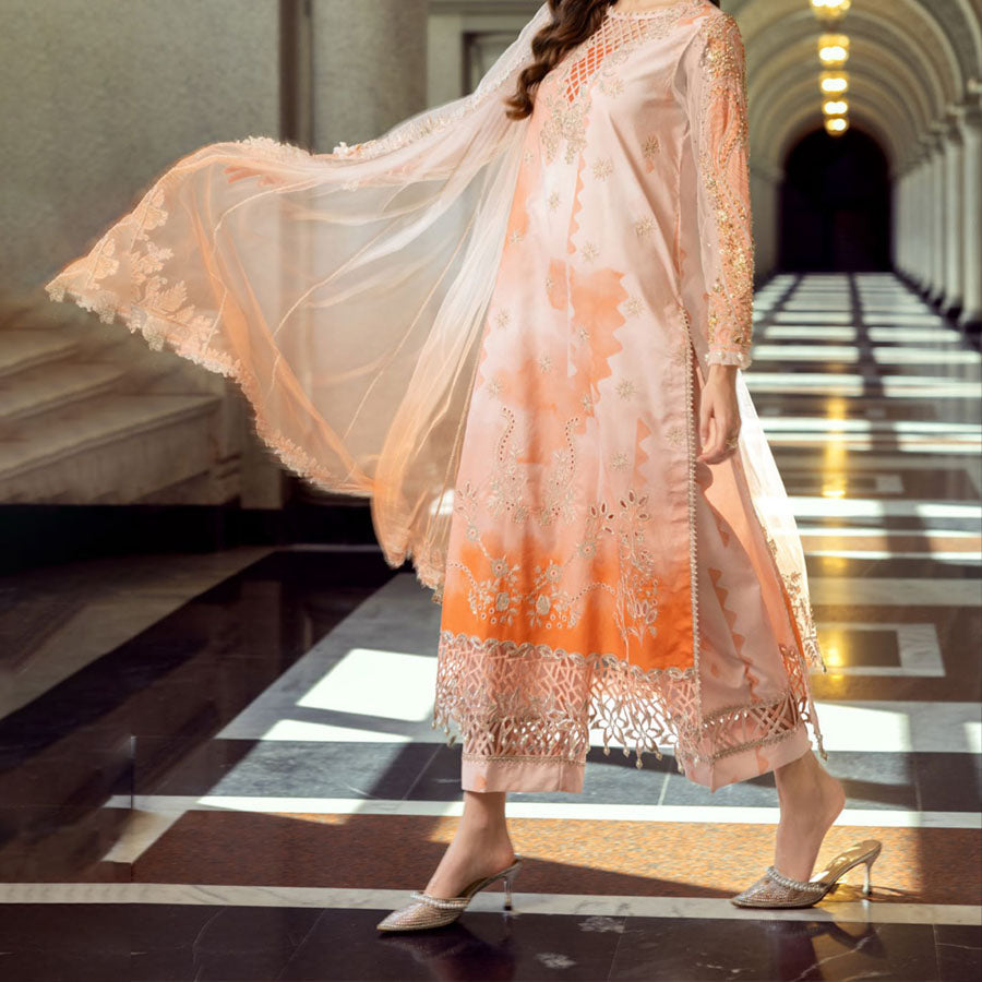 Charizma Festive Unstitched Collection 2025 – Two models wearing elegant embroidered Pakistani suits in pastel blue and golden yellow, featuring intricate handwork, sequins, and delicate embellishments, perfect for Eid celebrations and festive occasions.