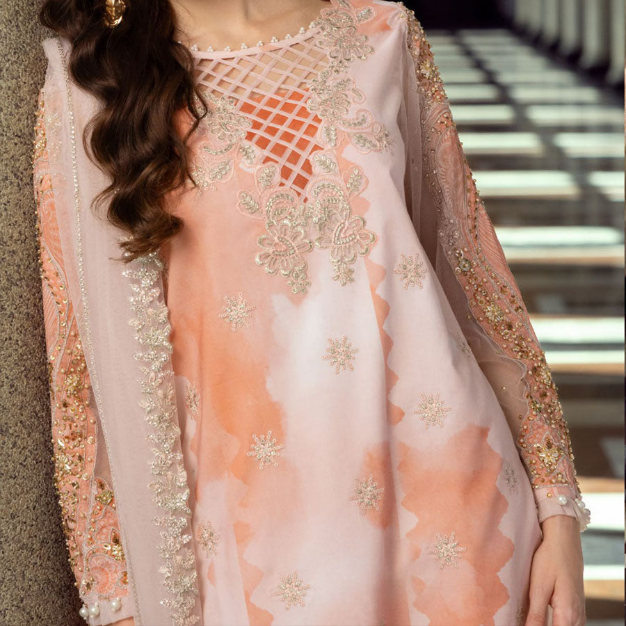 Charizma Festive Unstitched Collection 2025 – Two models wearing elegant embroidered Pakistani suits in pastel blue and golden yellow, featuring intricate handwork, sequins, and delicate embellishments, perfect for Eid celebrations and festive occasions.