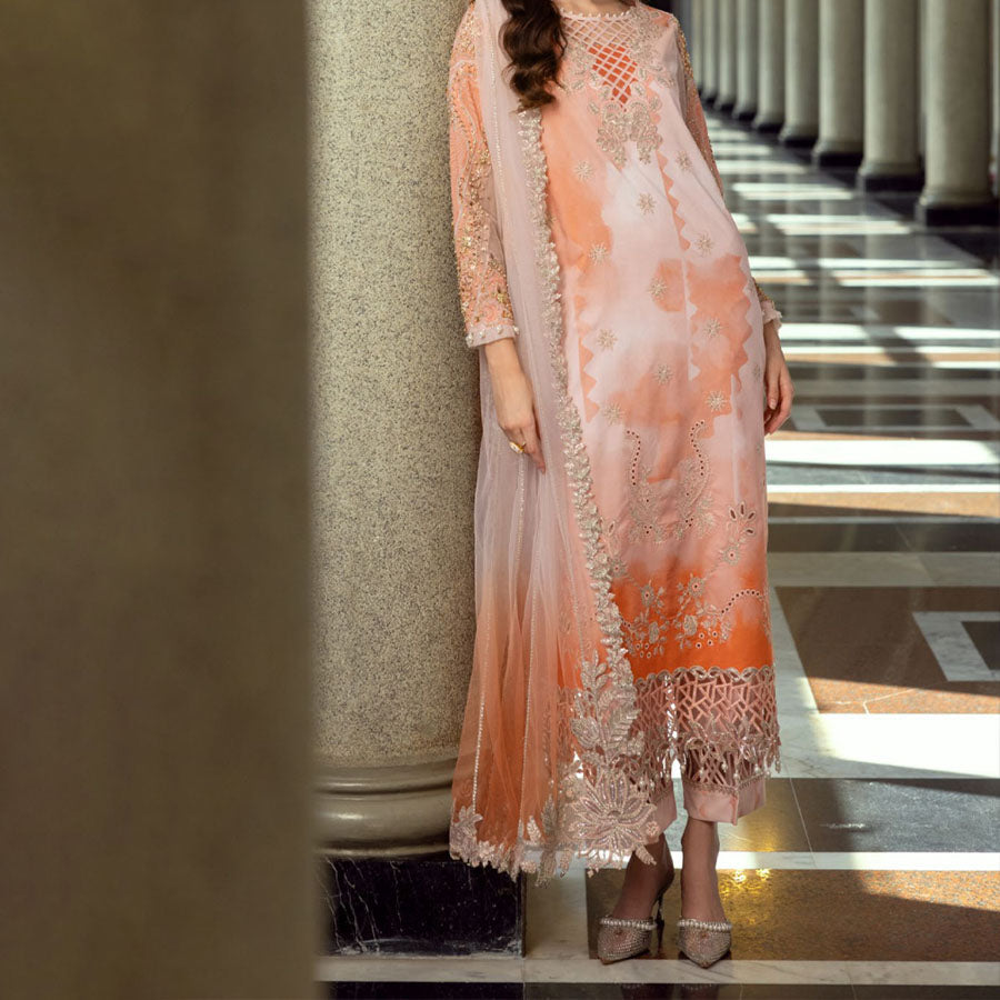 Charizma Festive Unstitched Collection 2025 – Two models wearing elegant embroidered Pakistani suits in pastel blue and golden yellow, featuring intricate handwork, sequins, and delicate embellishments, perfect for Eid celebrations and festive occasions.