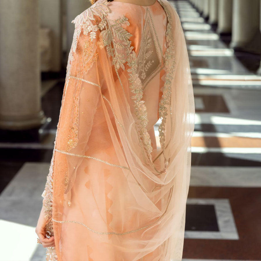 Charizma Festive Unstitched Collection 2025 – Two models wearing elegant embroidered Pakistani suits in pastel blue and golden yellow, featuring intricate handwork, sequins, and delicate embellishments, perfect for Eid celebrations and festive occasions.