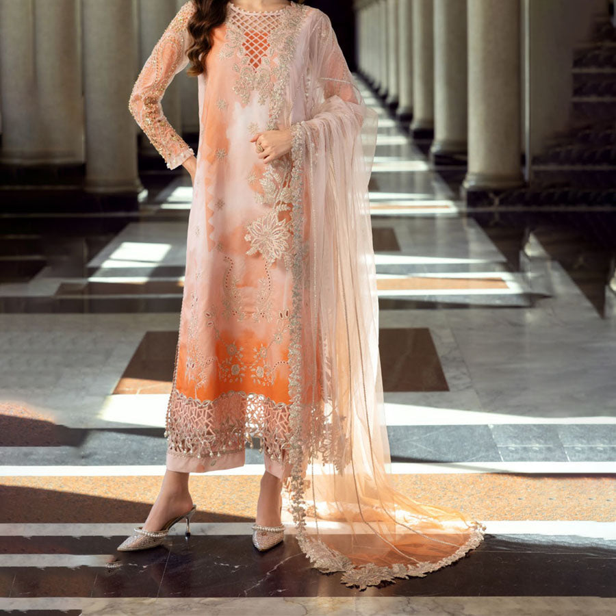 Charizma Festive Unstitched Collection 2025 – Two models wearing elegant embroidered Pakistani suits in pastel blue and golden yellow, featuring intricate handwork, sequins, and delicate embellishments, perfect for Eid celebrations and festive occasions.