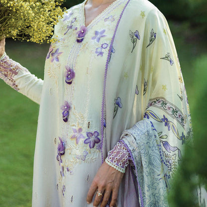 A model wearing a pastel embroidered lawn suit, featuring delicate floral patterns and a matching dupatta, ideal for summer occasions, sitting in a garden setting, showcasing traditional elegance and comfort, wearing a chickenkari embroidered dress.