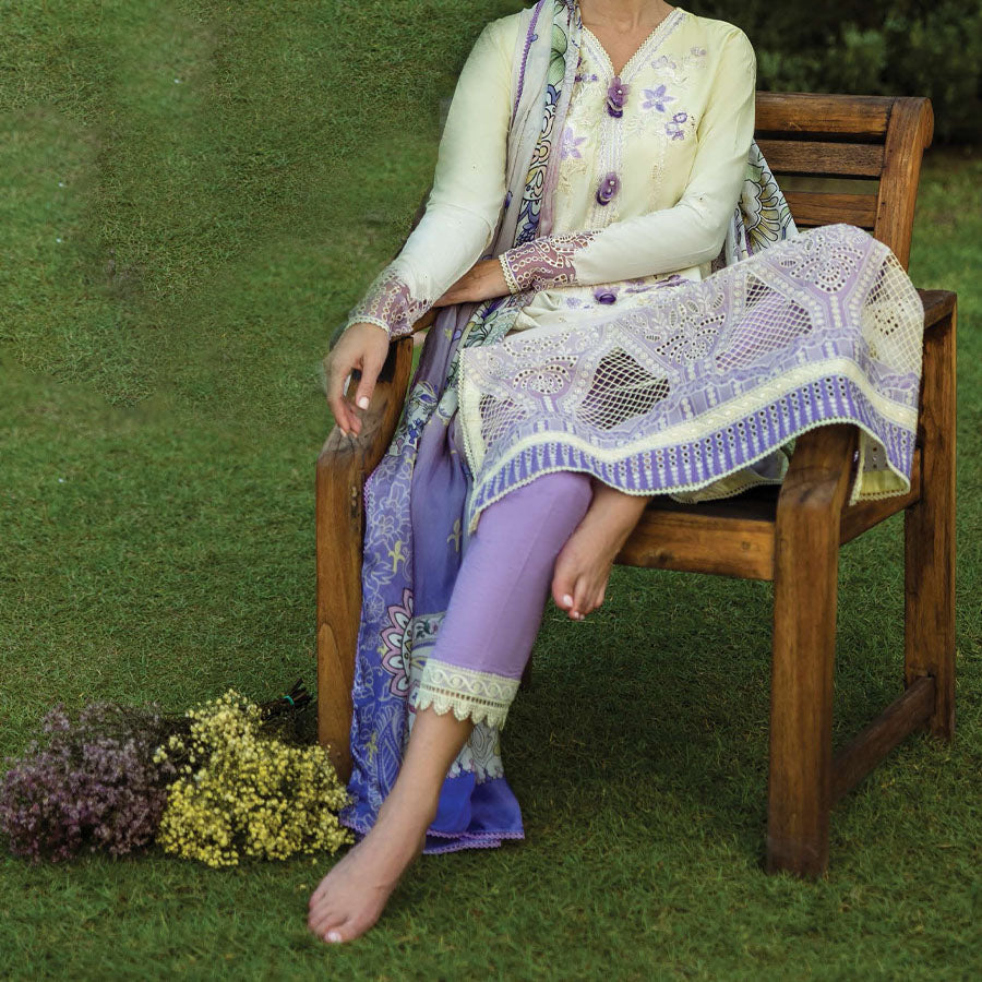 A model wearing a pastel embroidered lawn suit, featuring delicate floral patterns and a matching dupatta, ideal for summer occasions, sitting in a garden setting, showcasing traditional elegance and comfort, wearing a chickenkari embroidered dress.