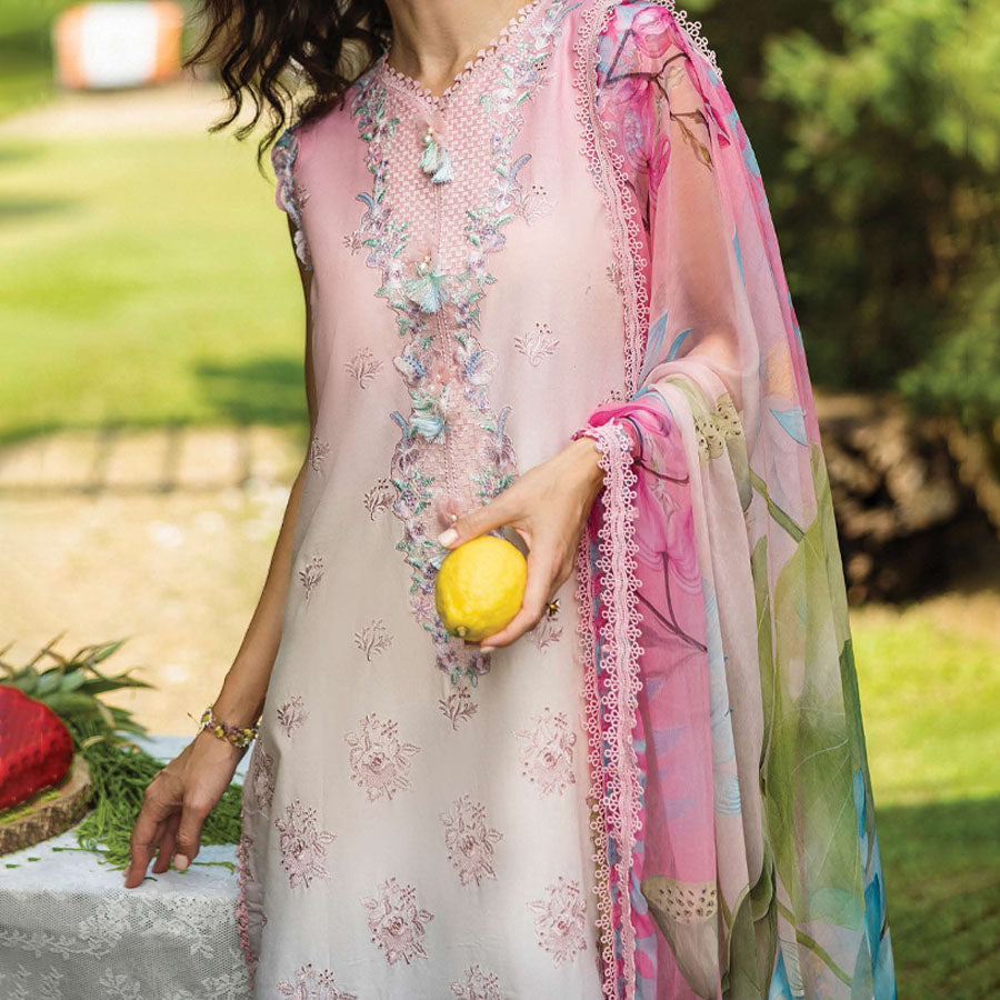 A model wearing a pastel embroidered lawn suit, featuring delicate floral patterns and a matching dupatta, ideal for summer occasions, sitting in a garden setting, showcasing traditional elegance and comfort, wearing a chickenkari embroidered dress.