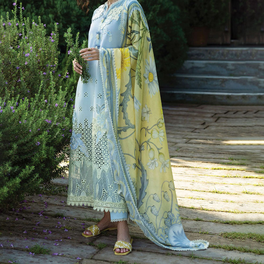A model wearing a pastel embroidered lawn suit, featuring delicate floral patterns and a matching dupatta, ideal for summer occasions, sitting in a garden setting, showcasing traditional elegance and comfort, wearing a chickenkari embroidered dress.