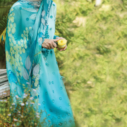 A model wearing a pastel embroidered lawn suit, featuring delicate floral patterns and a matching dupatta, ideal for summer occasions, sitting in a garden setting, showcasing traditional elegance and comfort, wearing a chickenkari embroidered dress.