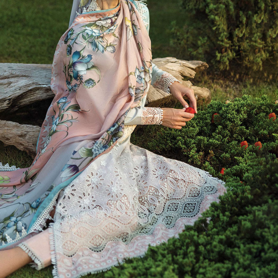 A model wearing a pastel embroidered lawn suit, featuring delicate floral patterns and a matching dupatta, ideal for summer occasions, sitting in a garden setting, showcasing traditional elegance and comfort, wearing a chickenkari embroidered dress.